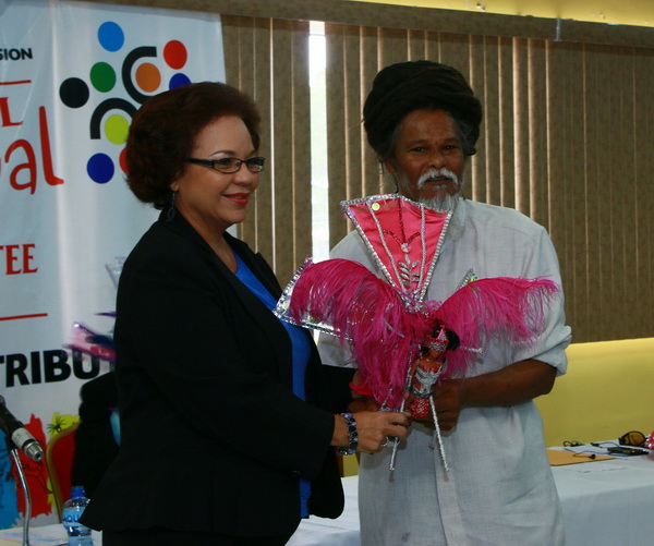 NCC Chairman, Lorraine Pouchet presents a token of appreciation to Junior Bisnath, San Fernando Carnival Committee